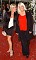 Wendy Richard, dressed elegantly in red and black, with colleague Letitia Dean