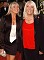 Wendy Richard, dressed elegantly in red and black, with colleague Letitia Dean