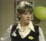 Wendy Richard as Shirley standing