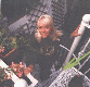Wendy Richard standing on a spiral staircase